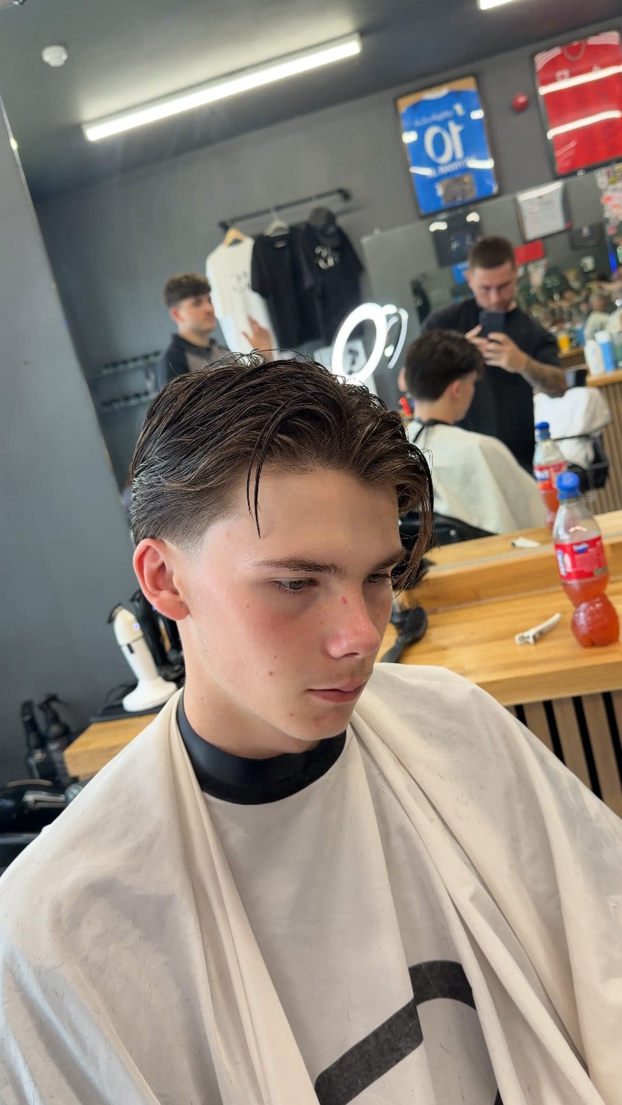 Slicked-back cut finished in the Moss studio